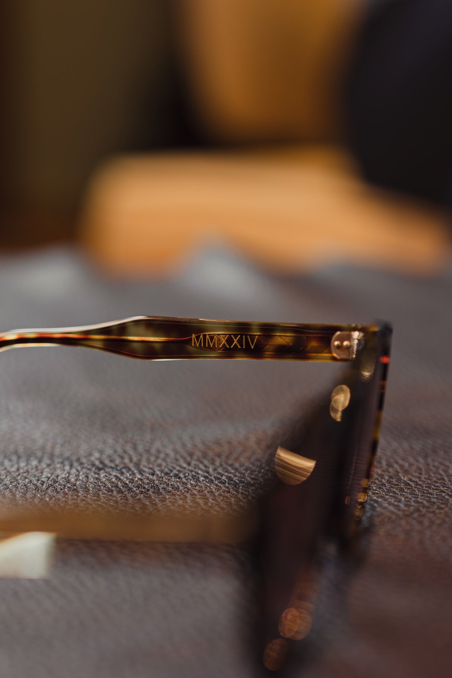Osman Abdul Razak menswear MMXXIV sunglasses offering timeless refinement with transitional amber lens detail