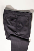 Refined menswear by Osman Abdul Razak rich brown trouser designed to complement neutral shirting and textured layers