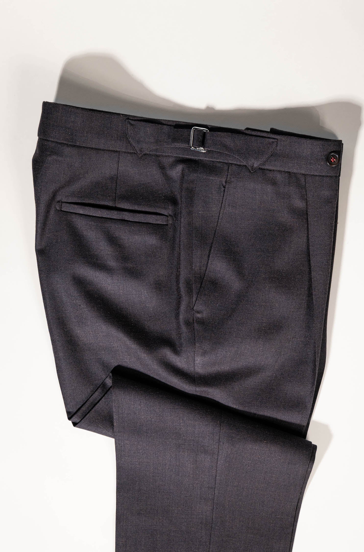 Refined menswear by Osman Abdul Razak rich brown trouser designed to complement neutral shirting and textured layers