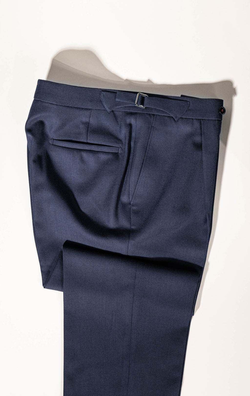 ailored elegance in Osman Abdul Razak menswear – deep navy trousers for versatile dressing