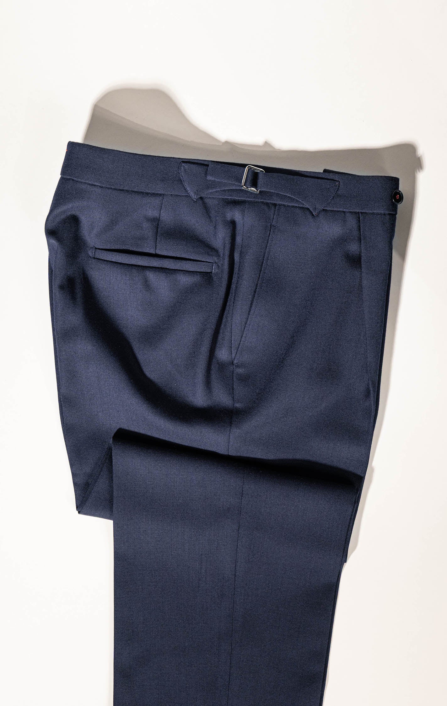 ailored elegance in Osman Abdul Razak menswear – deep navy trousers for versatile dressing