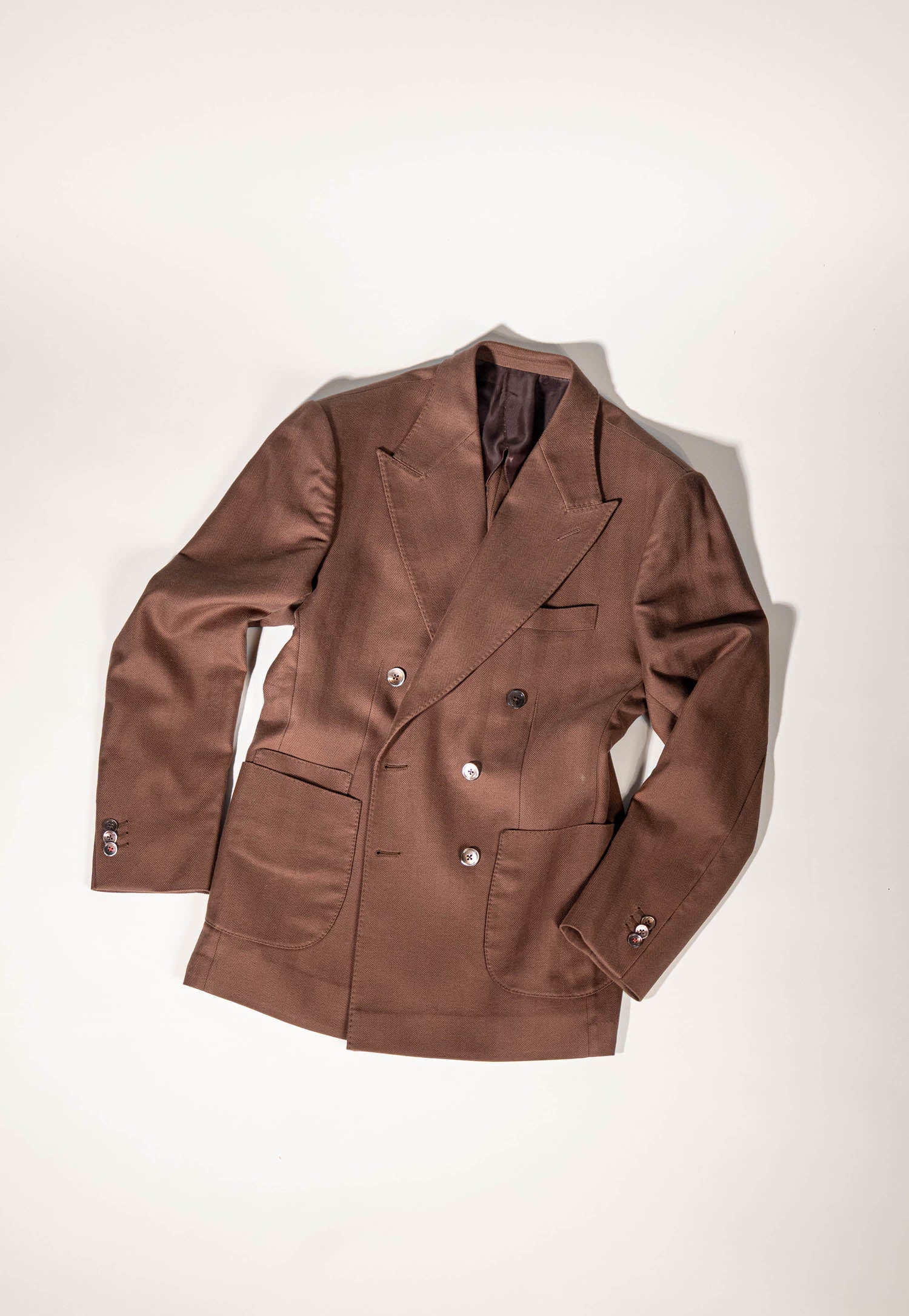Osman Abdul Razak menswear – rich brown double-breasted jacket with broad peak lapels