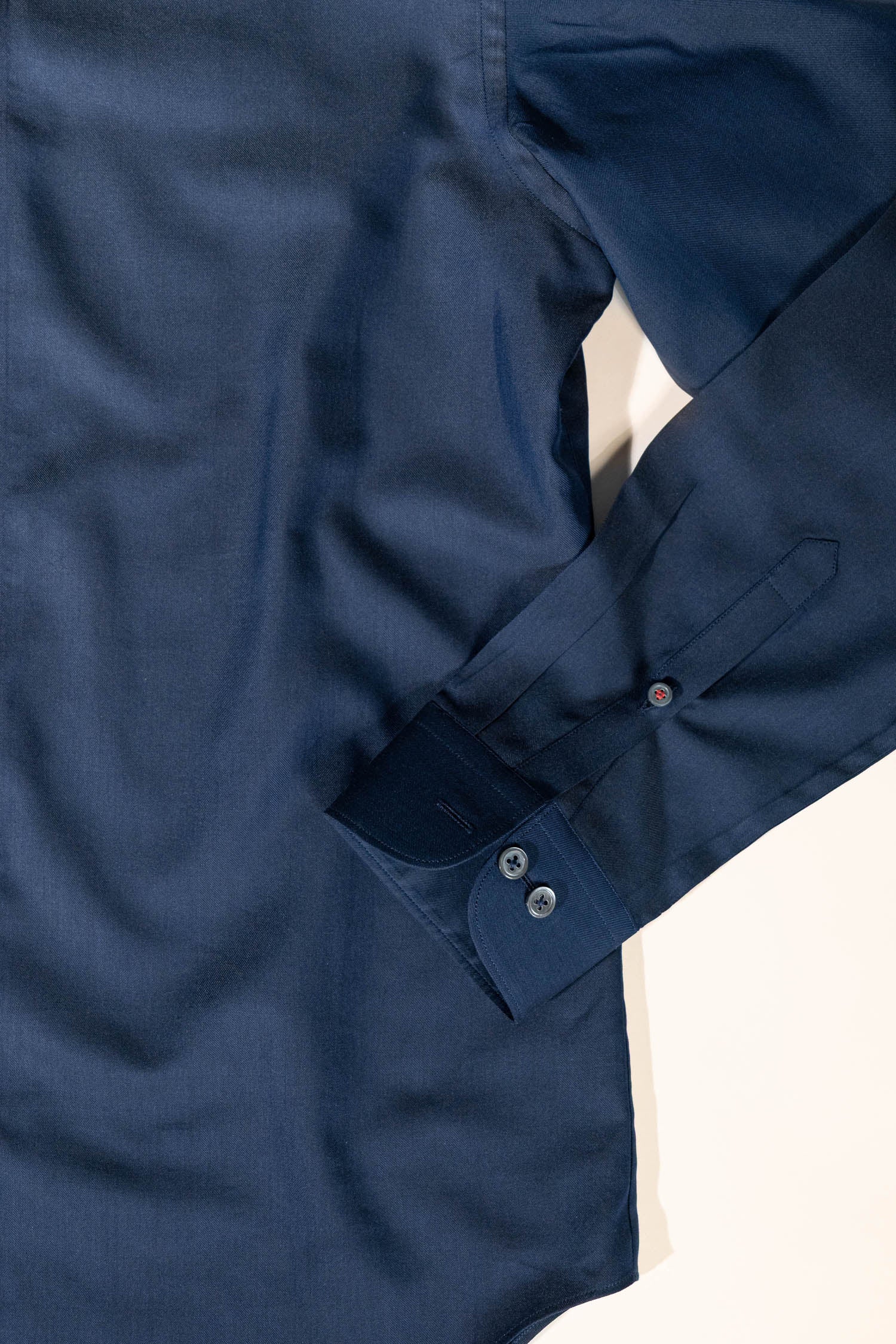 Elevated essentials by Osman Abdul Razak – deep navy shirt styled for refined everyday wear