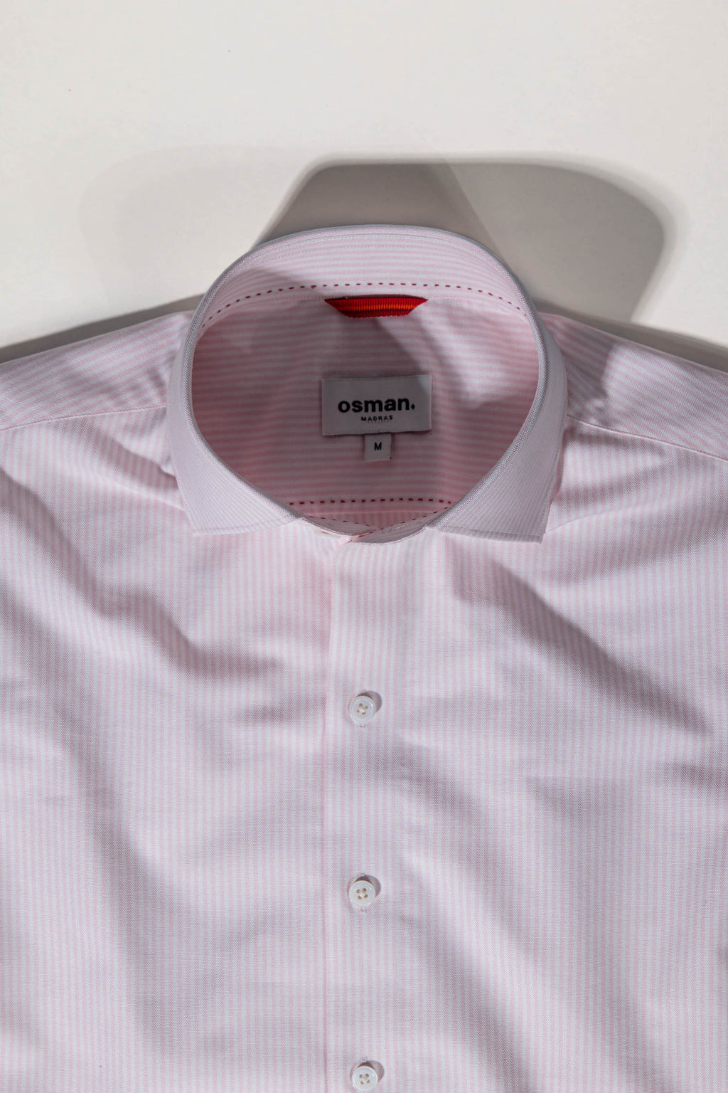 Tailored menswear by Osman Abdul Razak pink stripe shirt versatile for refined everyday style
