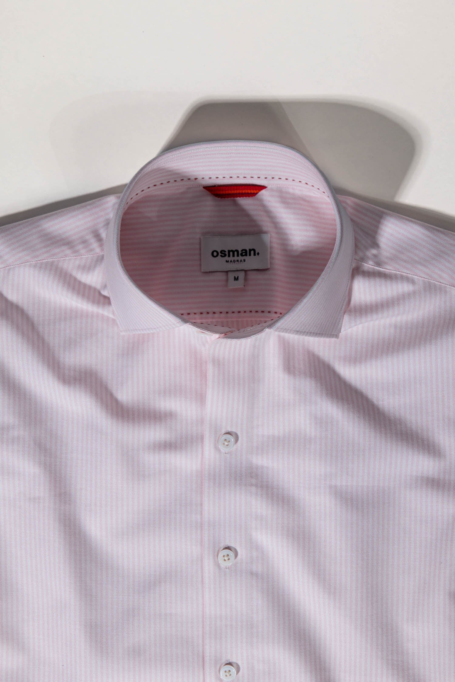 Tailored menswear by Osman Abdul Razak pink stripe shirt versatile for refined everyday style