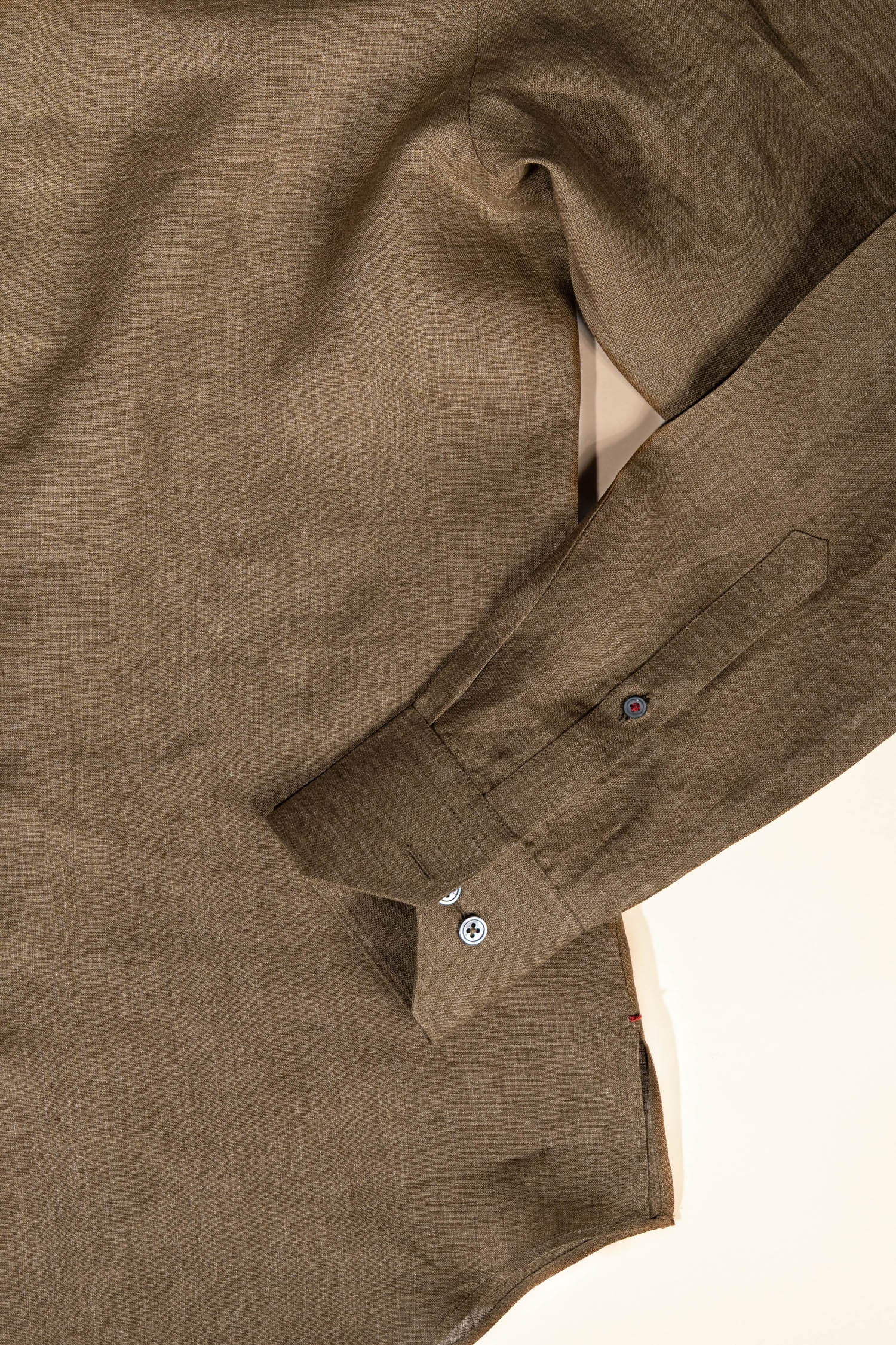 Refined menswear by Osman Abdul Razak – olive linen Capri shirt balancing softness and structure