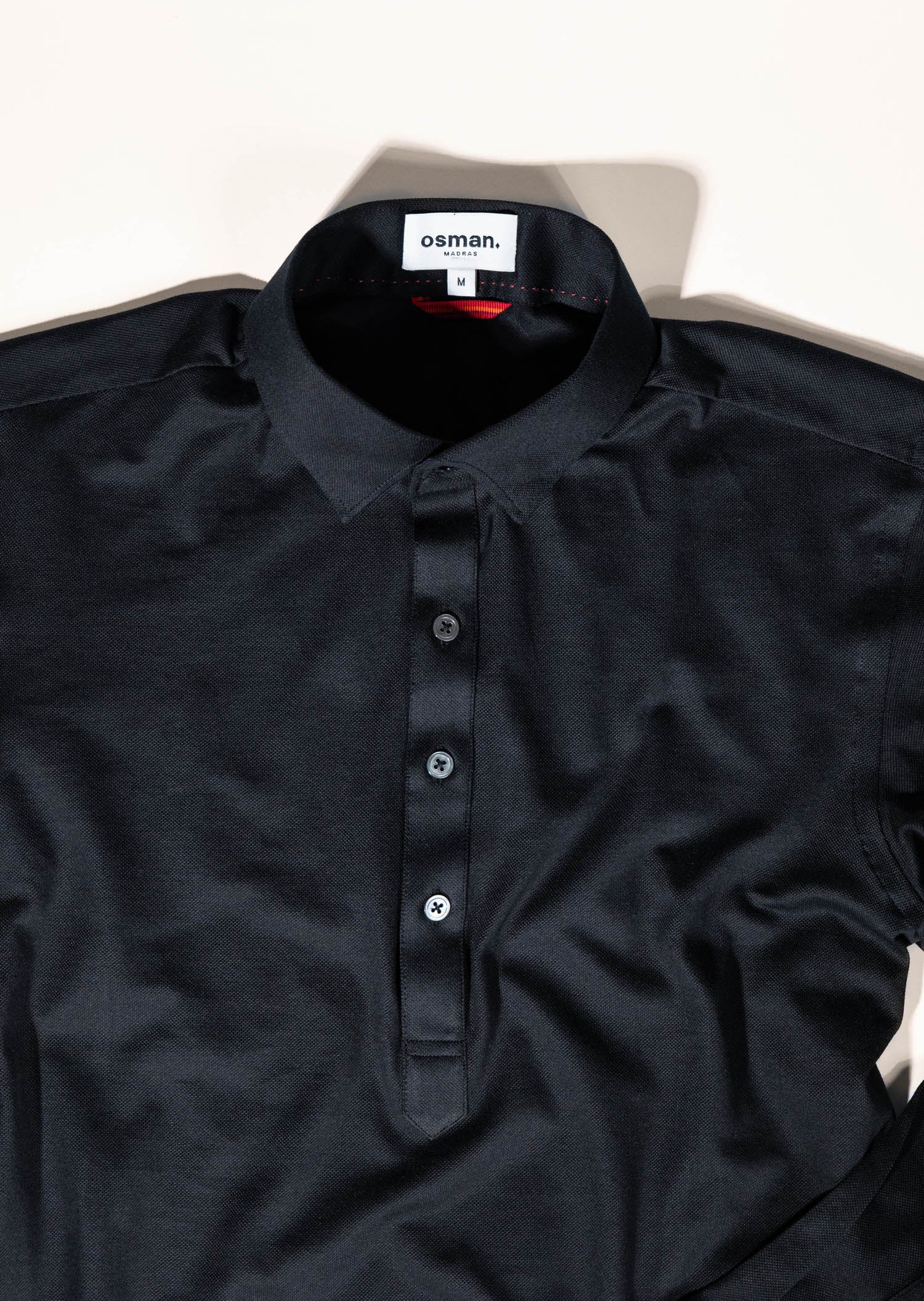 Tailored menswear by Osman Abdul Razak – breathable knit shirt for off-duty refinement and travel ease