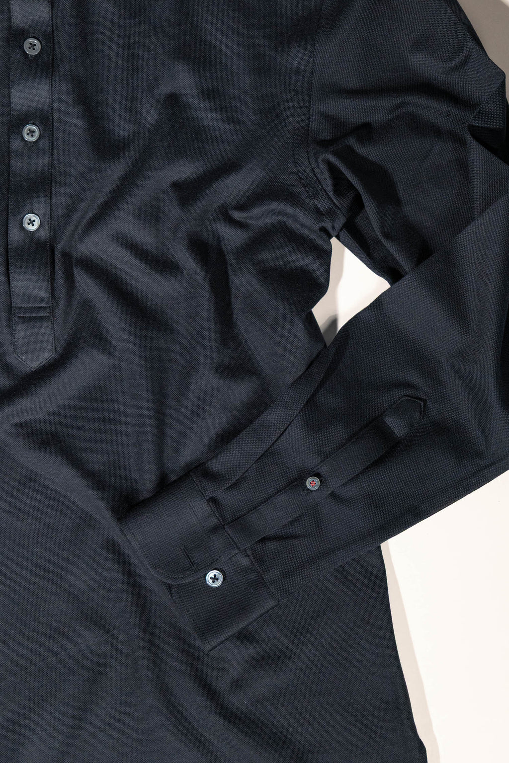 Refined menswear by Osman Abdul Razak – versatile knit shirt styled for layering or monochrome sophistication