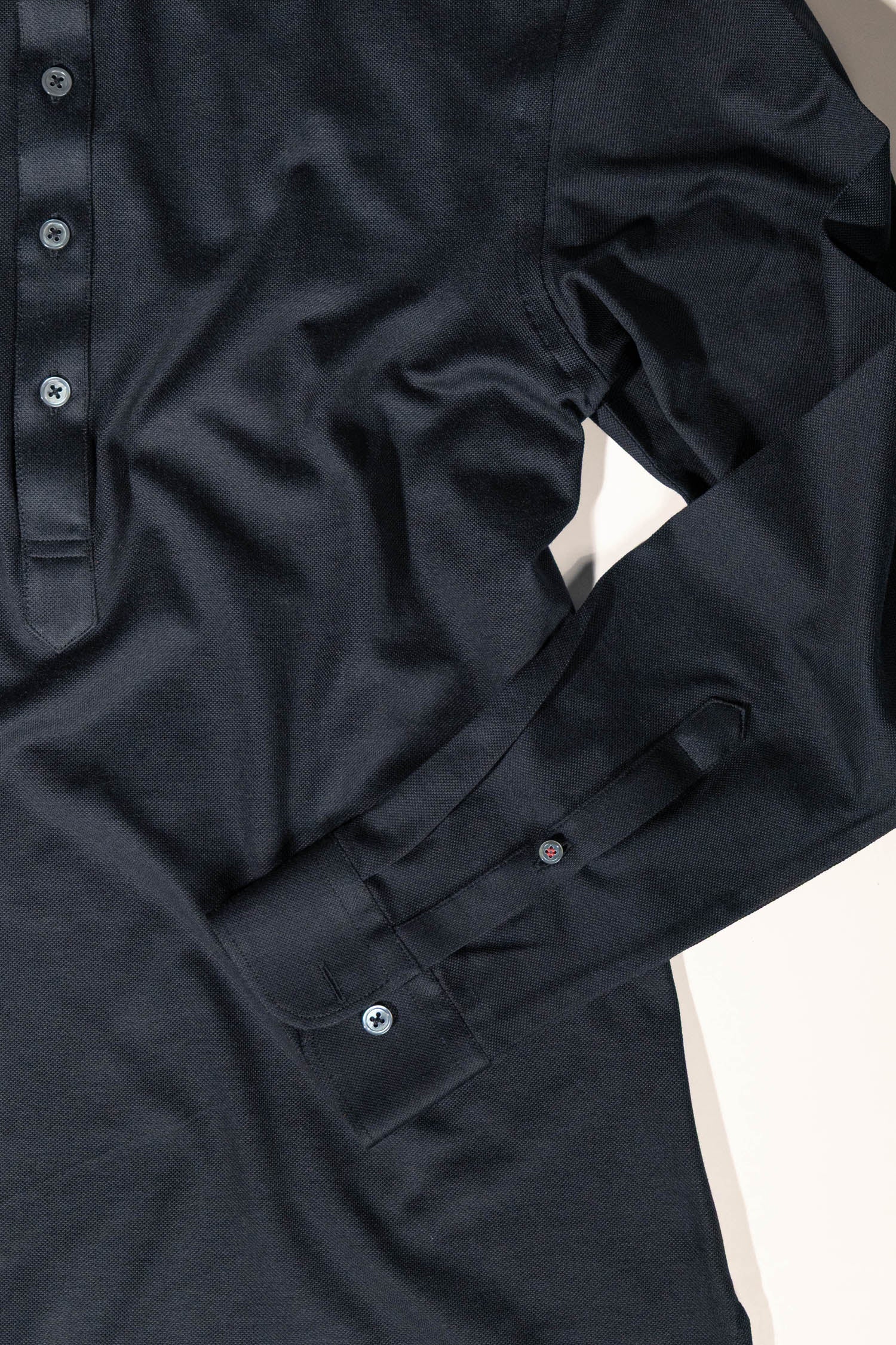 Refined menswear by Osman Abdul Razak – versatile knit shirt styled for layering or monochrome sophistication