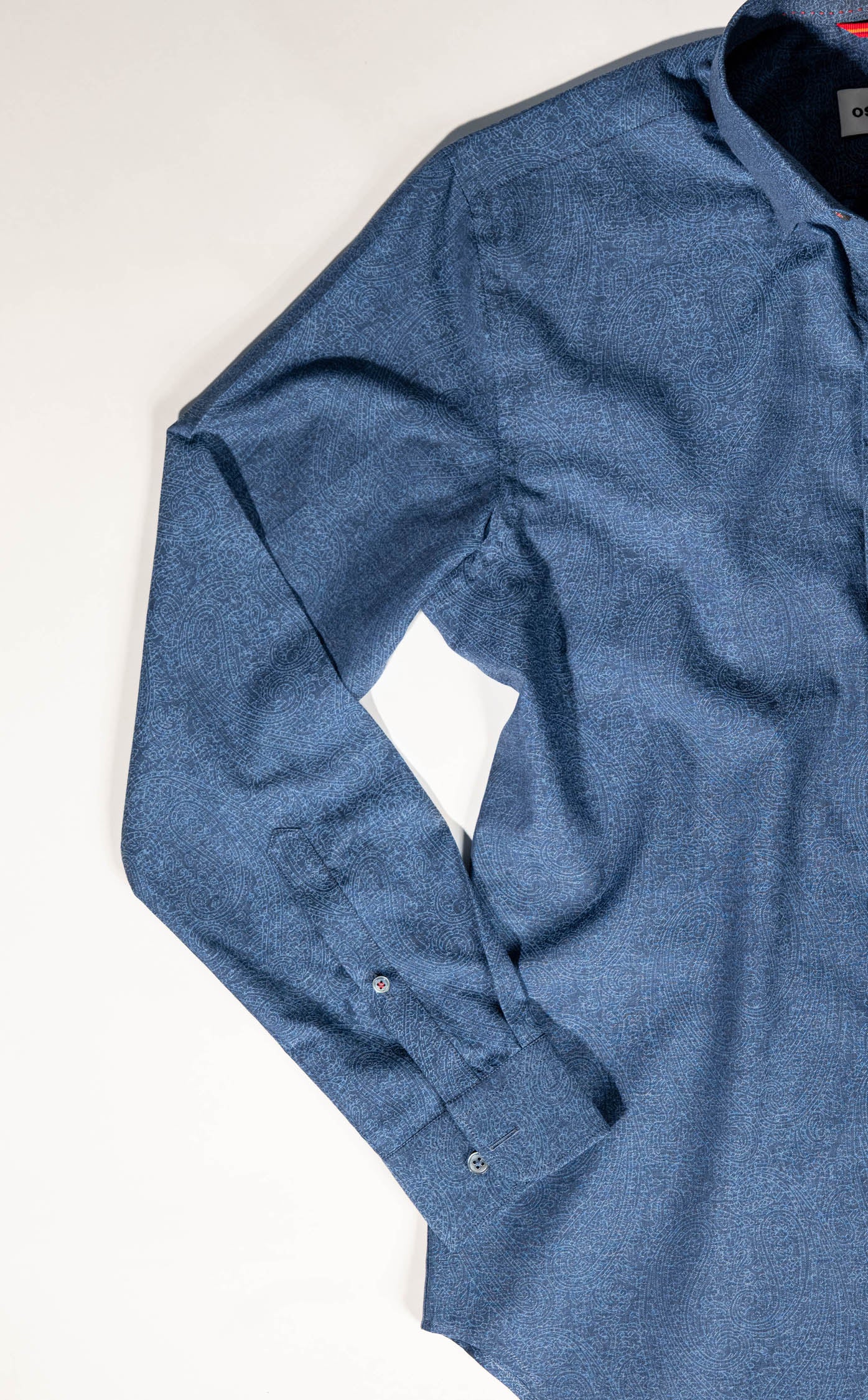 Refined menswear by Osman Abdul Razak – blue paisley shirt pairing seamlessly with jackets or light trousers