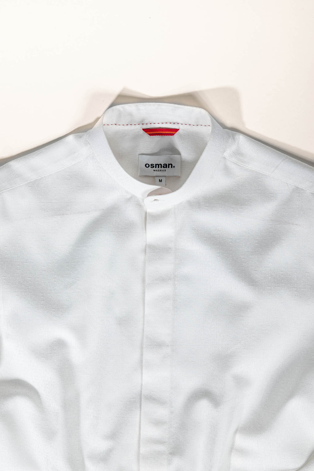 Refined menswear by Osman Abdul Razak – understated ivory dress shirt with structured silhouette