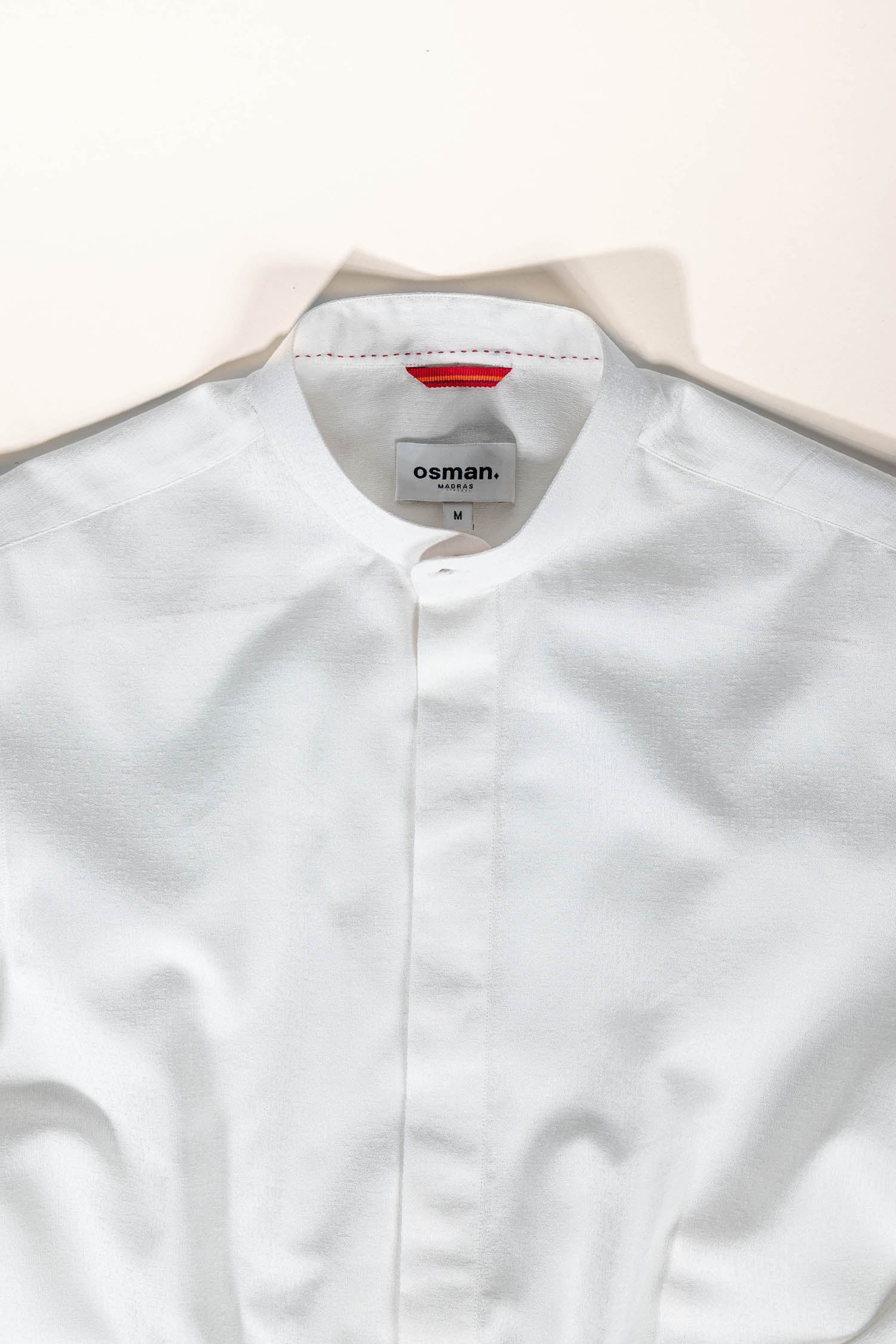 Refined menswear by Osman Abdul Razak – understated ivory dress shirt with structured silhouette