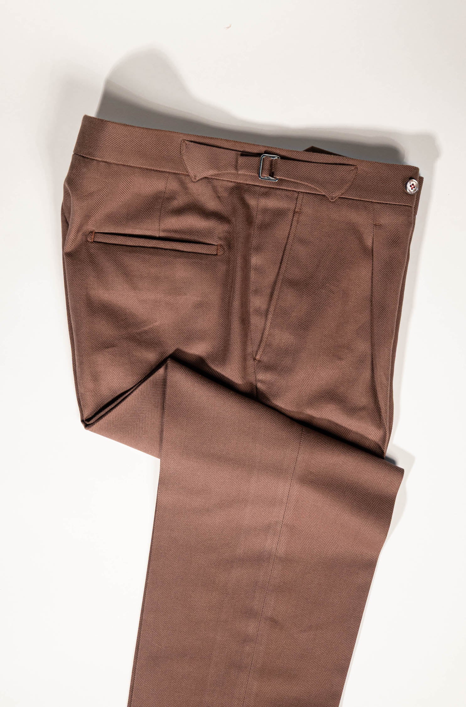 Refined menswear by Osman Abdul Razak – sun-warmed cinnamon trousers for versatile styling