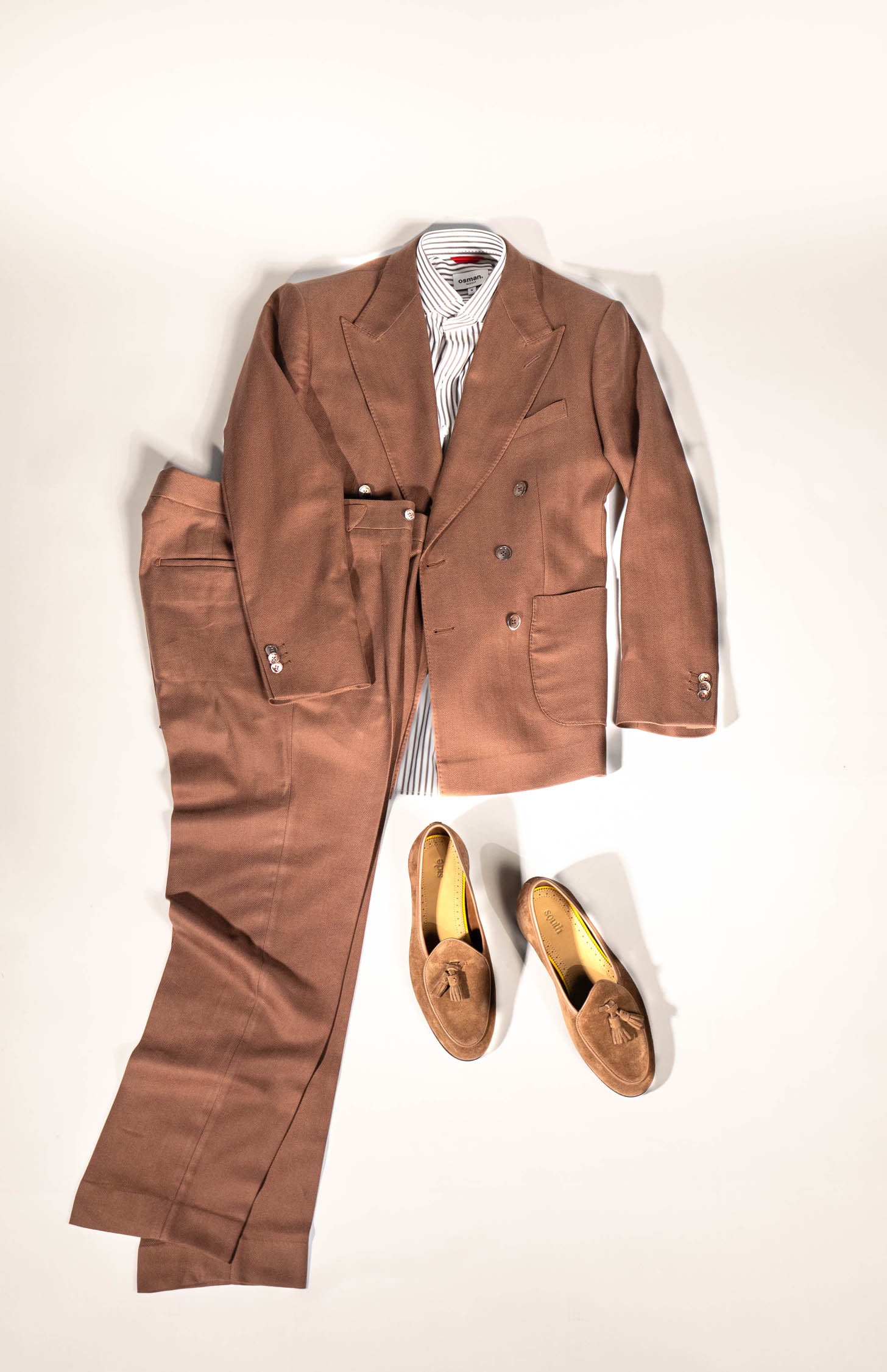 Refined menswear by Osman Abdul Razak – double-breasted jacket tailored for boardrooms