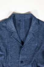 Refined menswear by Osman Abdul Razak – deep navy layering gilet with four-button closure