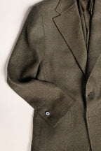 Tailored menswear by Osman Abdul Razak olive herringbone jacket blending heritage with contemporary style