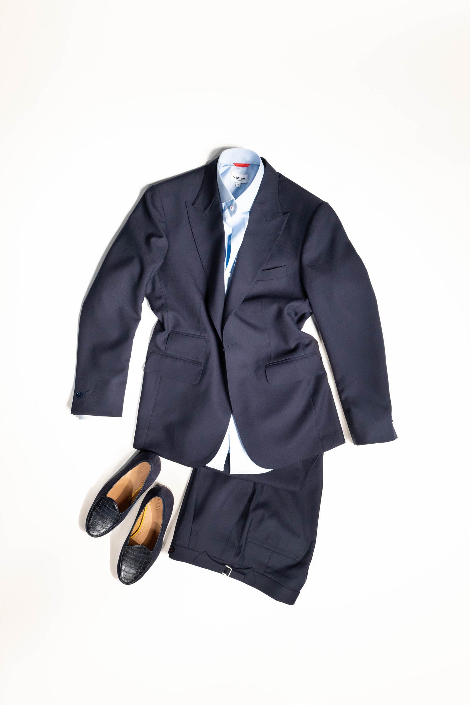 Refined menswear by Osman Abdul Razak Classic Single Breasted Jacket with red sleeve detail for subtle character