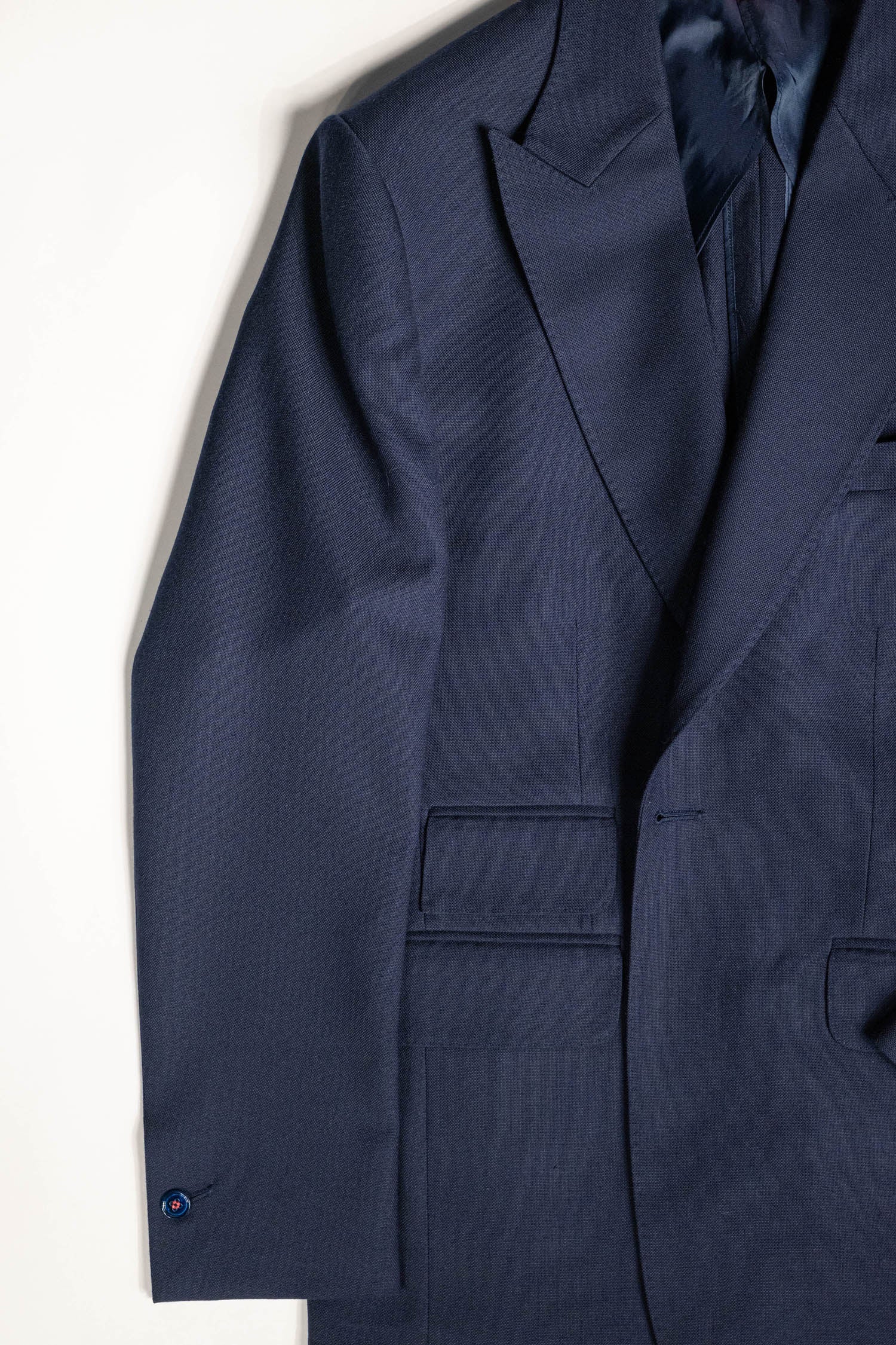 Tailored menswear by Osman Abdul Razak Classic Single Breasted Jacket with elongated silhouette and double slit