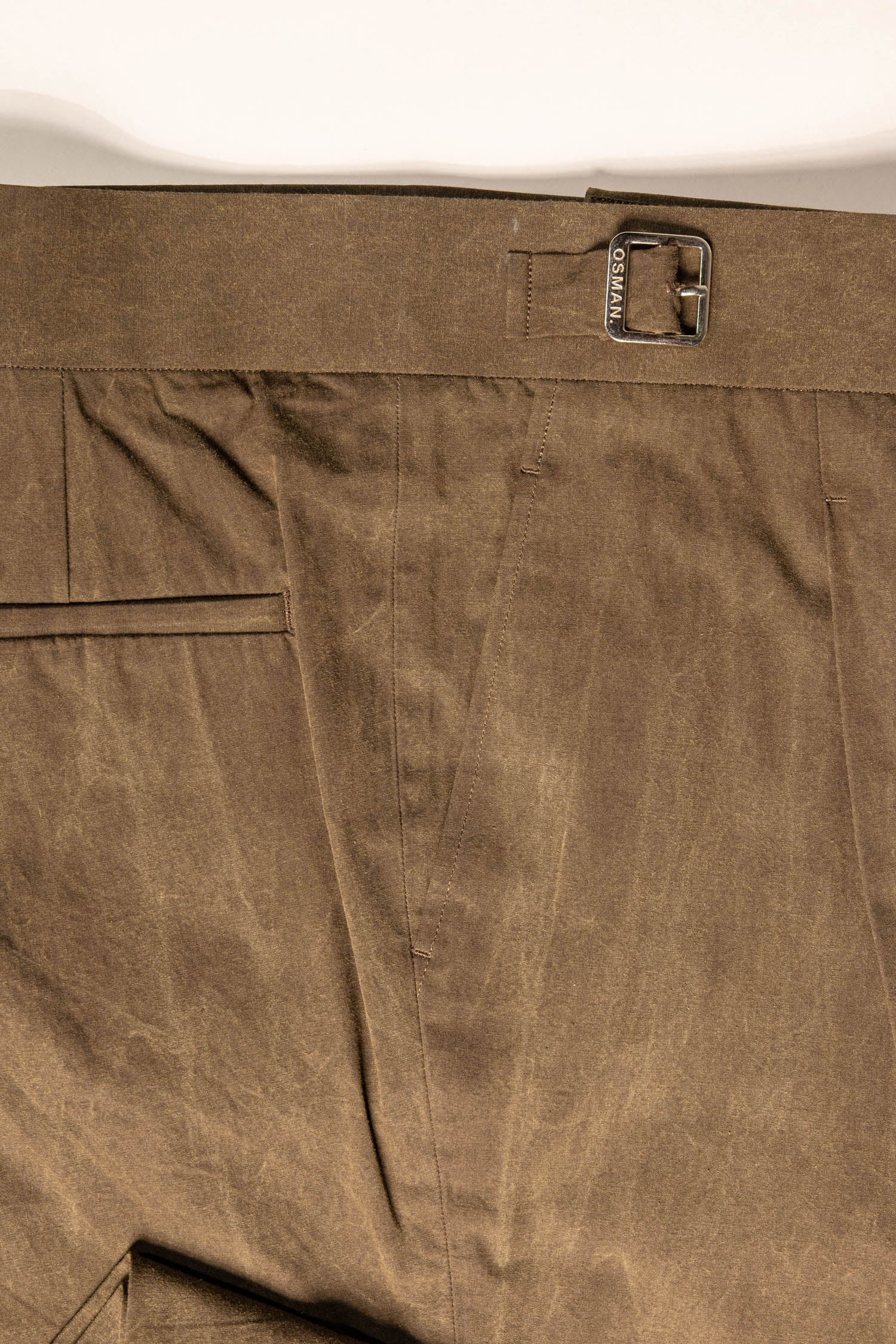 Tailored menswear by Osman Abdul Razak – rich olive trouser with pleat and centre crease for versatile styling