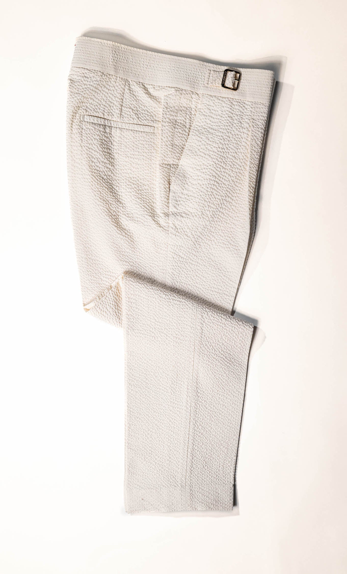 Osman Abdul Razak menswear – Eggshell Madras Trouser with relaxed cut, buckle waistband, and partial lining