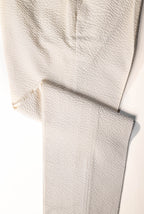 Osman Abdul Razak menswear – elegant eggshell trousers for warm climates and elevated seasonal dressing