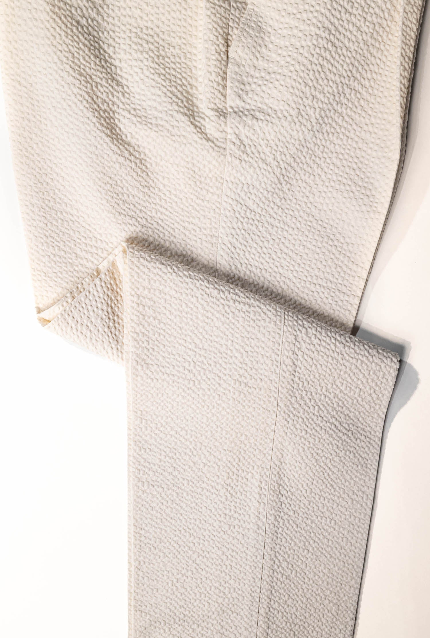 Osman Abdul Razak menswear – elegant eggshell trousers for warm climates and elevated seasonal dressing