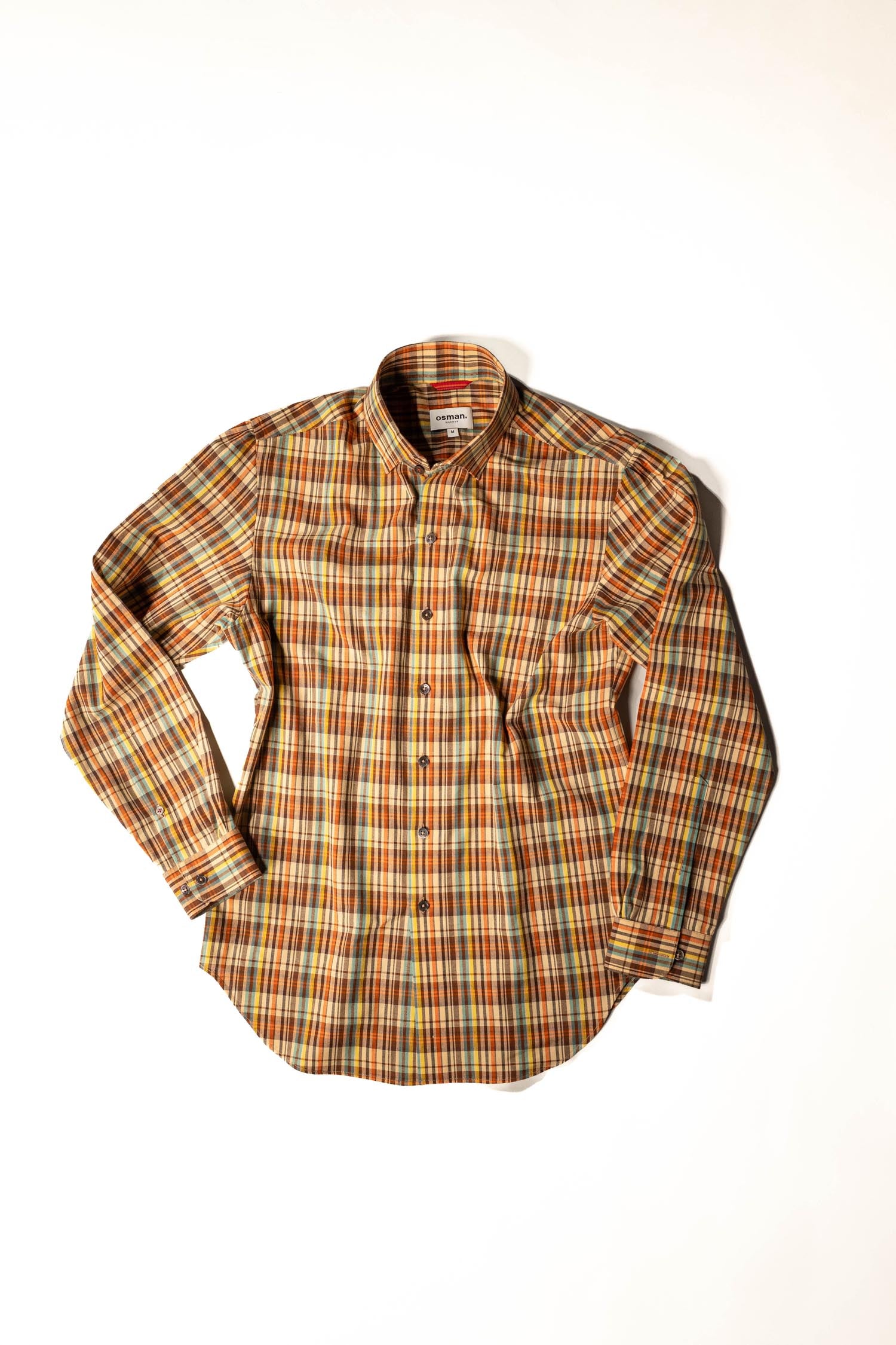 Refined menswear by Osman Abdul Razak – breathable Madras shirt blending structure with modern nostalgia
